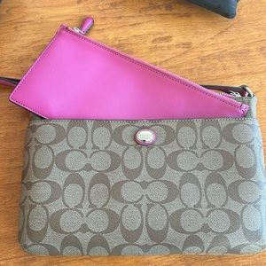 Coach purse with pink insert